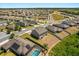 Areal view of house and neighborhood showing solar panels at 340 Irving Bend Dr, Groveland, FL 34736