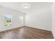 Bright bedroom with hardwood floors and natural light coming through the windows at 340 Irving Bend Dr, Groveland, FL 34736