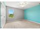 Comfortable bedroom with plush carpeting, a window and neutral color scheme at 340 Irving Bend Dr, Groveland, FL 34736