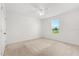 Bright bedroom with carpet, ceiling fan and a window with a view at 340 Irving Bend Dr, Groveland, FL 34736