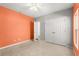 Bedroom features neutral carpeting, an open door way and closet at 340 Irving Bend Dr, Groveland, FL 34736