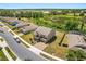 Well-manicured two-story home with attractive landscaping and view of a pond at 340 Irving Bend Dr, Groveland, FL 34736