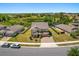Traditional-style two-story home with neutral exterior and landscaping at 340 Irving Bend Dr, Groveland, FL 34736