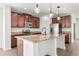 Well-equipped kitchen with stainless steel appliances, granite countertops, and ample cabinet space at 340 Irving Bend Dr, Groveland, FL 34736