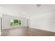 Minimalist living room showcasing natural light, sleek floors, and a clean, modern aesthetic at 340 Irving Bend Dr, Groveland, FL 34736