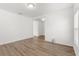 Minimalist living room with sleek flooring, neutral paint, and plenty of natural light at 340 Irving Bend Dr, Groveland, FL 34736