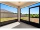 Screened patio providing views of the backyard and green space at 340 Irving Bend Dr, Groveland, FL 34736