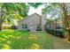 Spacious backyard featuring a well-maintained lawn, patio and mature landscaping at 3509 Battersea Ct, Belle Isle, FL 32812
