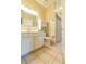 Clean bathroom featuring tile flooring, a toilet, a sink with a mirror, and vanity with storage at 3509 Battersea Ct, Belle Isle, FL 32812