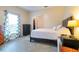 Cozy bedroom with soft lighting, a comfortable bed, and a closet, creating a peaceful retreat at 3509 Battersea Ct, Belle Isle, FL 32812