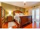 Elegant bedroom with wooden furniture, stylish bedding, and ample space for relaxation and rest at 3509 Battersea Ct, Belle Isle, FL 32812