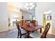 Elegant dining space with a view into the living room and kitchen, perfect for entertaining at 3509 Battersea Ct, Belle Isle, FL 32812
