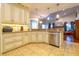 Modern kitchen with granite countertops, stainless steel appliances, and custom cabinetry at 3509 Battersea Ct, Belle Isle, FL 32812