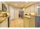 Well-appointed kitchen featuring stainless steel appliances and ample counter space at 3509 Battersea Ct, Belle Isle, FL 32812
