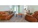 Spacious living room featuring comfortable seating, stylish curtains, and an open layout at 3509 Battersea Ct, Belle Isle, FL 32812