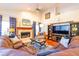 Inviting living room with a fireplace, comfortable seating, and stylish decor for a cozy atmosphere at 3509 Battersea Ct, Belle Isle, FL 32812