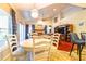 Bright and open living area with a dining space and seamless access to the kitchen at 3509 Battersea Ct, Belle Isle, FL 32812