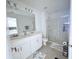 Bright bathroom with double sinks and glass-enclosed shower at 3623 Main Harbor Dr, Kissimmee, FL 34746