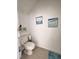 Bright half-bath with coastal decor and a modern toilet at 3623 Main Harbor Dr, Kissimmee, FL 34746