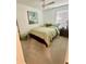 Cozy bedroom with neutral carpet, a ceiling fan, and a plush green bedspread, creating a comfortable and inviting space at 3623 Main Harbor Dr, Kissimmee, FL 34746