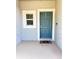 Inviting entryway with a stylish teal door, a small window for natural light, and a decorative welcome mat at 3623 Main Harbor Dr, Kissimmee, FL 34746
