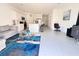 Open-concept living space featuring white walls, tile floors, modern furnishings, and an eat-in kitchen at 3623 Main Harbor Dr, Kissimmee, FL 34746