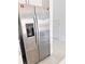 Modern, stainless steel refrigerator with water and ice dispenser at 3623 Main Harbor Dr, Kissimmee, FL 34746
