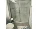 Clean bathroom featuring a full shower with glass sliding doors at 3623 Main Harbor Dr, Kissimmee, FL 34746