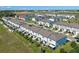 An aerial view of newly built homes with green lawns and nearby construction at 366 Madison Dr, Davenport, FL 33837