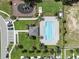 Aerial view of the community pool with a park and ample parking at 366 Madison Dr, Davenport, FL 33837