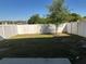 Fenced backyard with grass area and small tree at 366 Madison Dr, Davenport, FL 33837