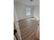 A comfortable bedroom has wood-look flooring and a large window with bright, natural light at 366 Madison Dr, Davenport, FL 33837