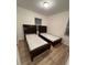The bedroom features two beds with mattresses and wood-look flooring at 366 Madison Dr, Davenport, FL 33837