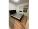 Bedroom with laminate flooring and natural light from a window at 366 Madison Dr, Davenport, FL 33837