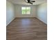 Bedroom featuring wood-look flooring, a ceiling fan, and natural light at 366 Madison Dr, Davenport, FL 33837