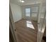 Bedroom with window and wood-look flooring at 366 Madison Dr, Davenport, FL 33837