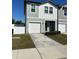 Charming two-story townhouse with an attached garage and well-maintained front yard at 366 Madison Dr, Davenport, FL 33837