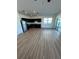Bright kitchen with stainless steel appliances and modern cabinetry with hardwood flooring at 366 Madison Dr, Davenport, FL 33837