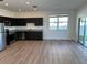 Open-concept kitchen and dining area with sliding glass doors to the backyard at 366 Madison Dr, Davenport, FL 33837