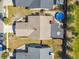 Aerial view of a home showing the layout, roof, backyard pool, deck, and surrounding landscape at 387 Kantor Blvd, Casselberry, FL 32707