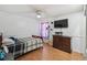 Bedroom with hardwood floors, ceiling fan, and a cabinet with TV on top at 387 Kantor Blvd, Casselberry, FL 32707