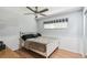Cozy bedroom with hardwood floors, ceiling fan, and a comfortable bed at 387 Kantor Blvd, Casselberry, FL 32707