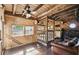 Bright bonus room with natural wood accents, windows, and a ceiling fan at 387 Kantor Blvd, Casselberry, FL 32707