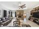 Spacious living room features stone fireplace, ceiling fan and tile flooring at 387 Kantor Blvd, Casselberry, FL 32707