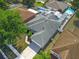 Aerial view of a home with a private pool, a screened-in patio and well manicured landscaping at 4008 Lakeside Reserve Ct, Orlando, FL 32810