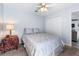 Bedroom with neutral tones, ceiling fan, closet and cozy carpet flooring at 4008 Lakeside Reserve Ct, Orlando, FL 32810