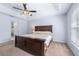Primary bedroom features a tray ceiling, ceiling fan, and ensuite bathroom at 4008 Lakeside Reserve Ct, Orlando, FL 32810