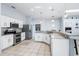 Well-equipped kitchen with granite countertops, stainless steel appliances, and white cabinetry at 4008 Lakeside Reserve Ct, Orlando, FL 32810