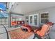 Enclosed pool area with covered patio, stylish furniture, and a sparkling pool, perfect for relaxation at 4008 Lakeside Reserve Ct, Orlando, FL 32810