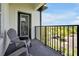 Relaxing balcony with outdoor seating and views of the lush green landscape at 4126 Breakview Dr # 40901, Orlando, FL 32819